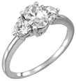 1.25 Carat Three-Stone Oval and Round Diamond Engagement Ring