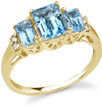 Emerald-Shaped Three-Stone Cathedral Blue Topaz Ring in 14K Yellow Gold